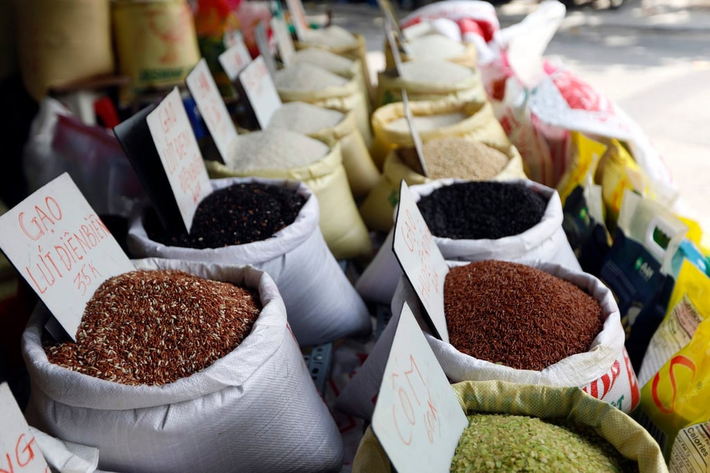 Bags of rice are displayed for sale at a street market in Hanoi. Vietnamese traders say that high-quality rice could soon fetch as much as US$700 per tonne. Photo: EPA-EFE Bags of rice are displayed for sale at a street market in Hanoi. Vietnamese traders say that high-quality rice could soon fetch as much as US$700 per tonne. Photo: EPA-EFE