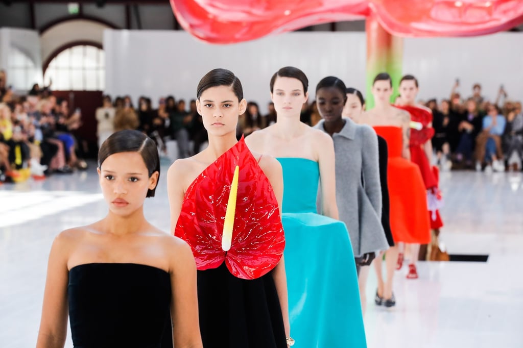 Models present creations from the womenswear ready-to-wear spring/summer 2023 collection by Loewe during a presentation at the Paris Fashion Week (PFW), in Paris, in September 2022 – including the brand’s eye-catching anthurium dress. Photo: EPA-EFE