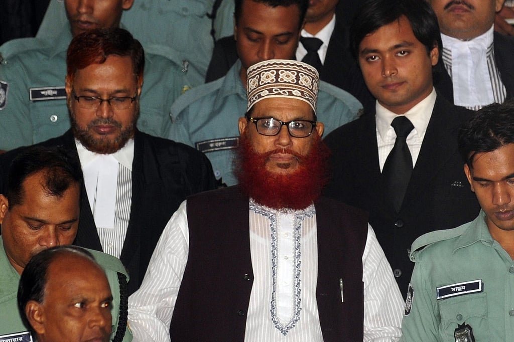 Delwar Hossain Sayedee, centre, at the Bangladesh International Crimes Tribunal in Dhaka in 2011. Photo: AFP Delwar Hossain Sayedee, centre, at the Bangladesh International Crimes Tribunal in Dhaka in 2011. Photo: AFP