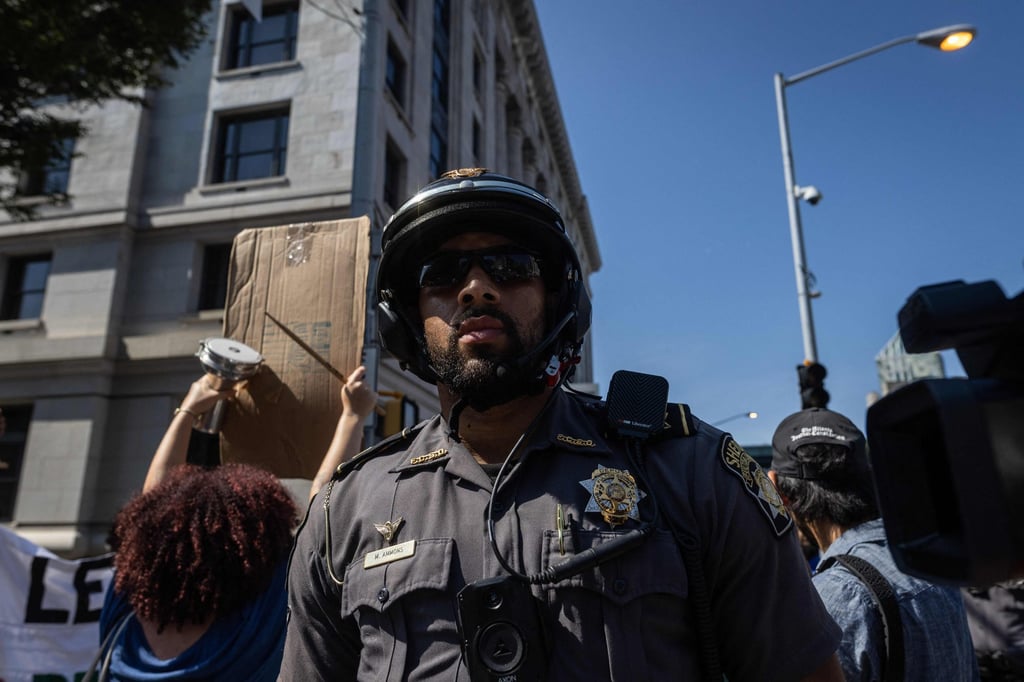 Police officers at the Lewis R Slaton Courthouse in Atlanta, Georgia ahead of an expected indictment of former US President Donald Trump on Monday. Photo: AFP Police officers at the Lewis R Slaton Courthouse in Atlanta, Georgia ahead of an expected indictment of former US President Donald Trump on Monday. Photo: AFP