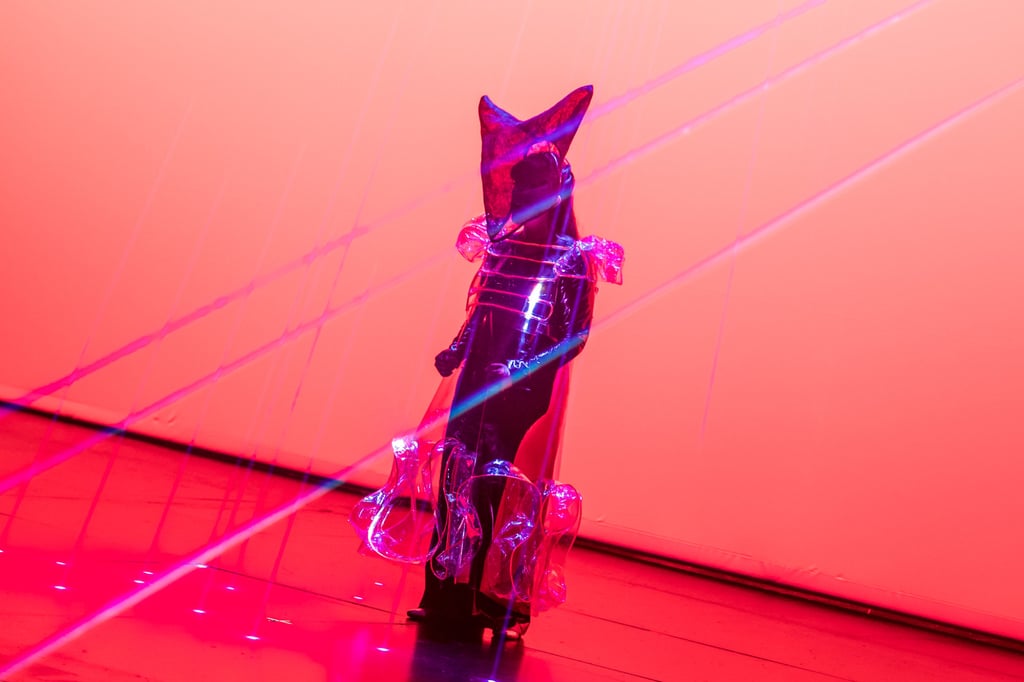 The film portion of The Once and Future is enhanced by a laser display that interacts with the images on screen, as well as a costumed figure appearing on stage. Photo: Singapore International Festival of Arts 2022