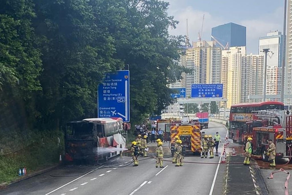 Firefighters put out the flames while police stand guard nearby. Photo: Handout Firefighters put out the flames while police stand guard nearby. Photo: Handout