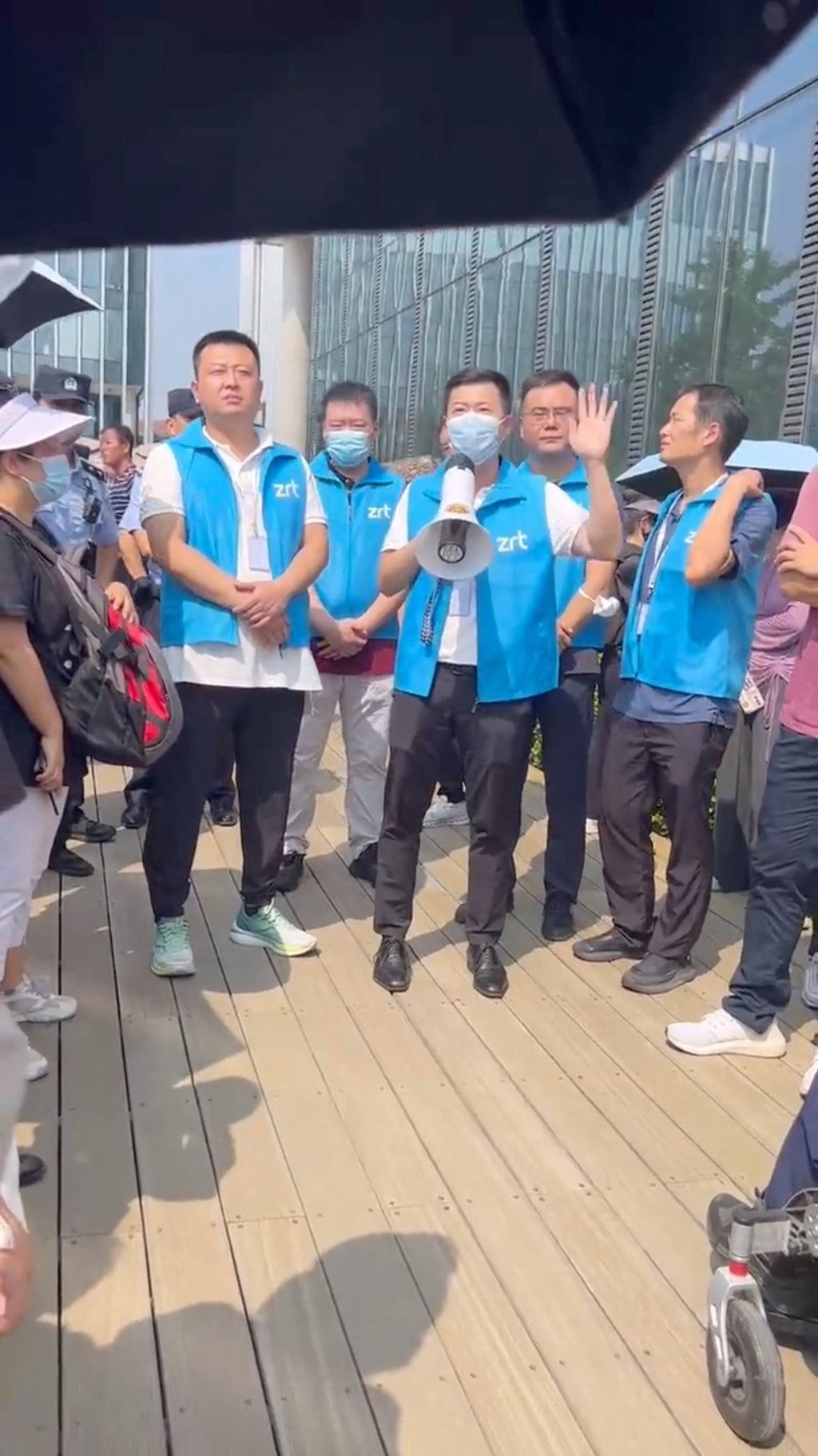 People protest outside Zhongrong International Trust’s office in Beijing, in this screengrab obtained from a social media video released on Wednesday. Photo: Reuters People protest outside Zhongrong International Trust’s office in Beijing, in this screengrab obtained from a social media video released on Wednesday. Photo: Reuters