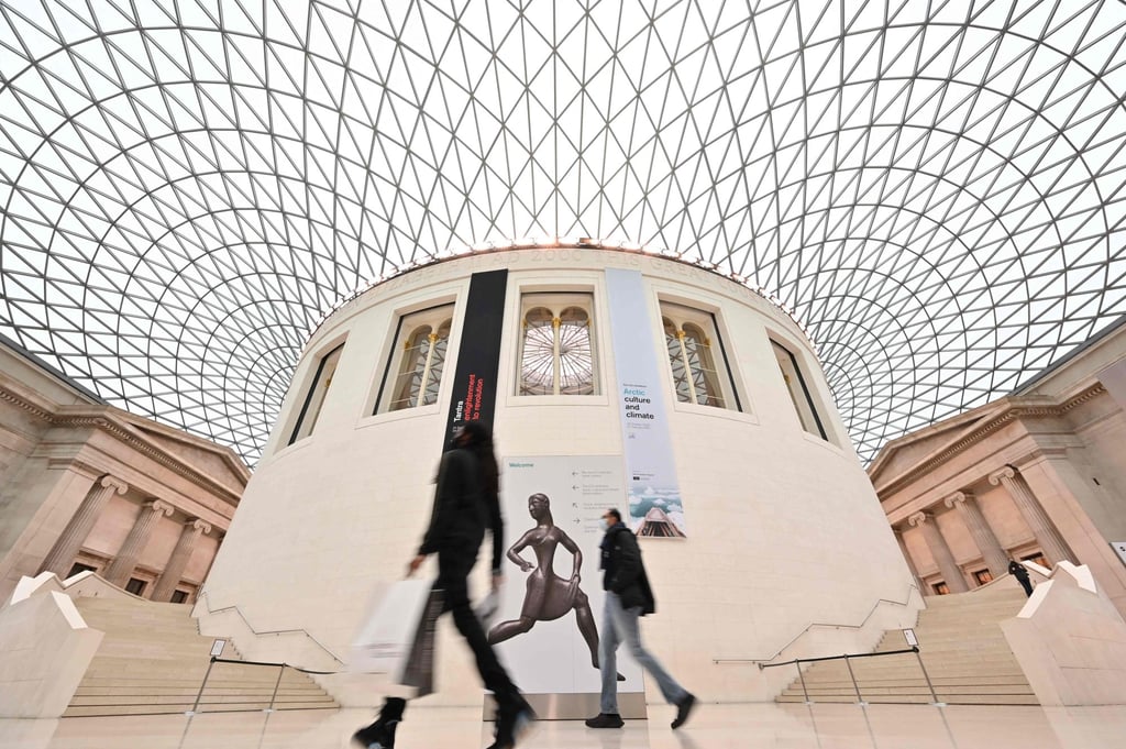 Visitors are seen in the Great Court after the British Museum reopened in London in December 2020 after a pandemic lockdown. Photo: AFP