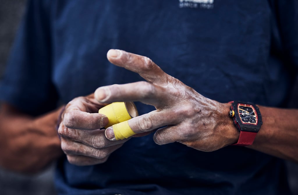 Mountaineer Charles Dubouloz prepares for a climb with his tape, chalk and RM 67-02 Automatic Extra Flat. Photo: Handout Mountaineer Charles Dubouloz prepares for a climb with his tape, chalk and RM 67-02 Automatic Extra Flat. Photo: Handout