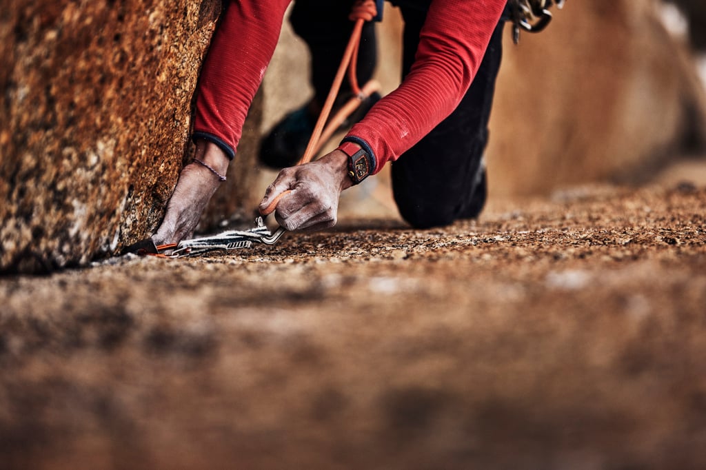Mountaineer Charles Dubouloz clips in his climbing rope, the RM 67-02 Automatic Extra Flat visible on his wrist. Photo: Handout Mountaineer Charles Dubouloz clips in his climbing rope, the RM 67-02 Automatic Extra Flat visible on his wrist. Photo: Handout