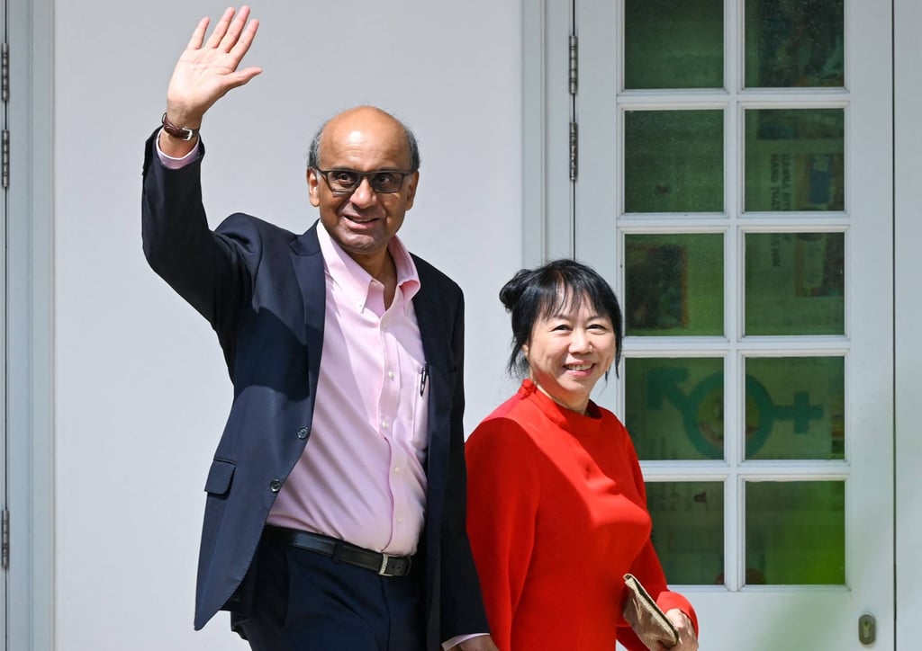Presidential candidate Tharman Shanmugaratnam (left) waves on Tuesday as he arrives at the nomination centre for Singapore’s presidential election. Photo: AFP Presidential candidate Tharman Shanmugaratnam (left) waves on Tuesday as he arrives at the nomination centre for Singapore’s presidential election. Photo: AFP