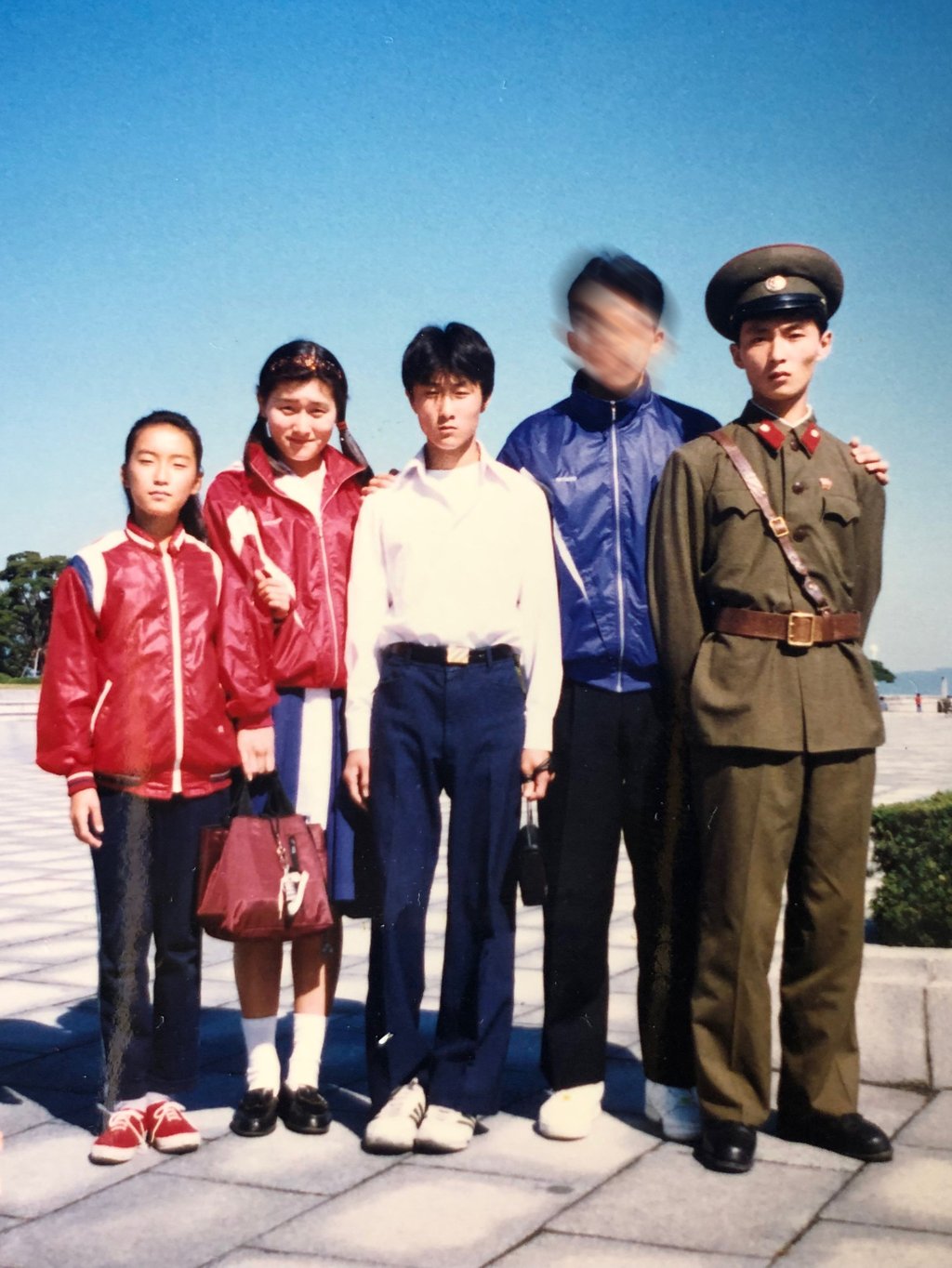 Hyangsu Park (second from the left) and her cousins pose for a photograph in North Korea. The man with a blurred face is a family friend who wished to remain anonymous. Photo: Hyangsu Park/Handout Hyangsu Park (second from the left) and her cousins pose for a photograph in North Korea. The man with a blurred face is a family friend who wished to remain anonymous. Photo: Hyangsu Park/Handout