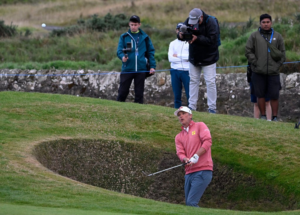 Australia’s Matt Jones chips out of a greenside bunker during the final round of the St Andrews Bay Championship. Photo: Asian Tour.
