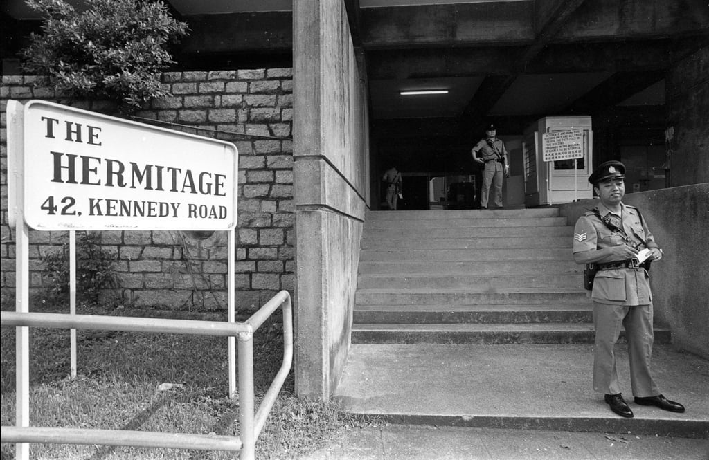 British police inspector Graham Dallas died of stab wounds and inspector Jeffrey Davison was seriously injured in the Hermitage Building on Kennedy Road. Policemen went to the scene to carry out an investigation. Photo: SCMP British police inspector Graham Dallas died of stab wounds and inspector Jeffrey Davison was seriously injured in the Hermitage Building on Kennedy Road. Policemen went to the scene to carry out an investigation. Photo: SCMP