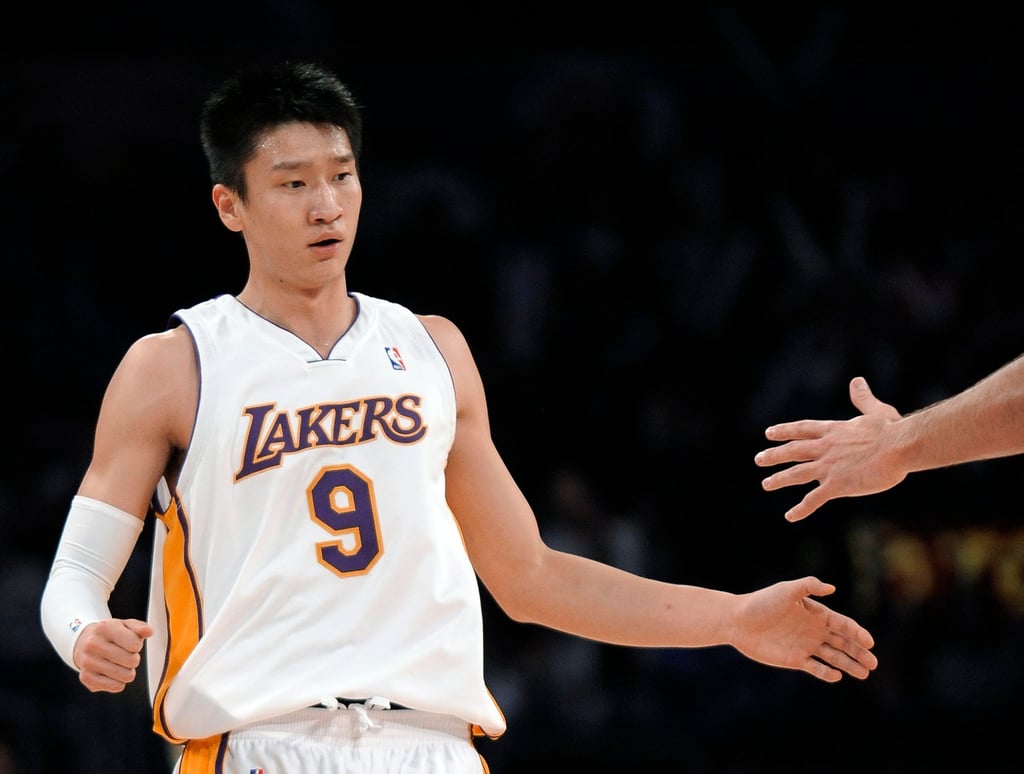 Los Angeles Lakers guard Sun Yue celebrates after scoring his first NBA points on a jumper against Milwaukee Bucks on December 7, 2008. Photo: AP