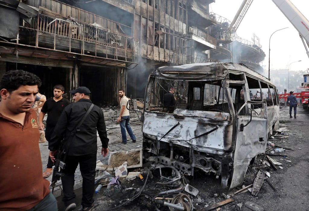 Iraqi police inspect the site of suicide car bomb attack in the Karada district of central Baghdad, Iraq on July 3, 2016. Photo: EPA / Ali Abbas Iraqi police inspect the site of suicide car bomb attack in the Karada district of central Baghdad, Iraq on July 3, 2016. Photo: EPA / Ali Abbas