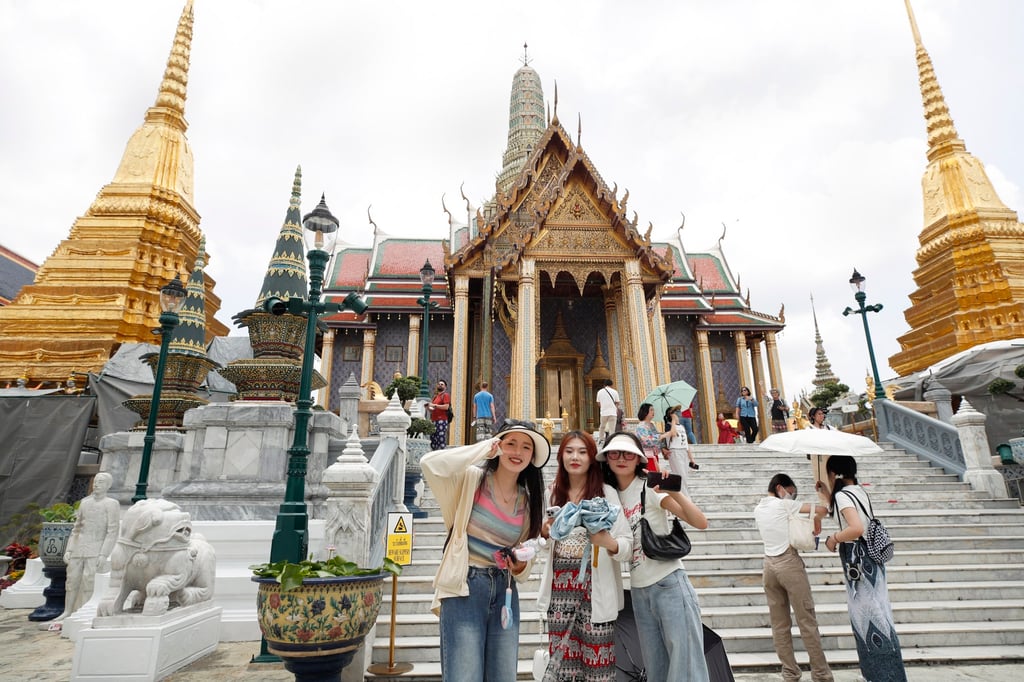 Chinese tourists visit the Temple of the Emerald Buddha in Bangkok earlier this year. Chinese tourist arrivals to the Thai resort island of Phuket are currently only 30 per cent of pre-pandemic levels, a tourism official said. Photo: EPA-EFE