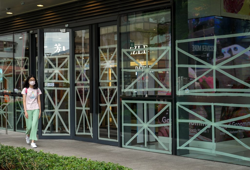 Windows are taped in Hong Kong as the typhoon approaches. Photo: Sam Tsang