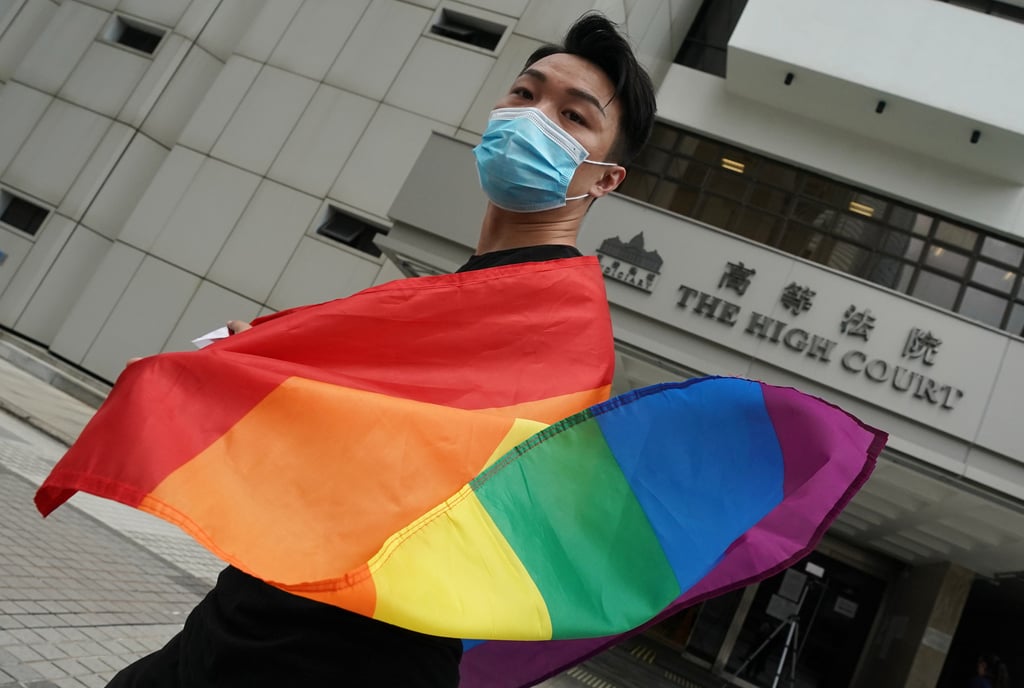 Jimmy Sham poses with the rainbow flag at the High Court in Hong Kong. His five-year legal battle for his New York marriage to be recognised at home has helped raise awareness, with a poll this year showing over 60 per cent of respondents supported same-sex marriage, almost double the number in 2013. Photo: Felix Wong Jimmy Sham poses with the rainbow flag at the High Court in Hong Kong. His five-year legal battle for his New York marriage to be recognised at home has helped raise awareness, with a poll this year showing over 60 per cent of respondents supported same-sex marriage, almost double the number in 2013. Photo: Felix Wong