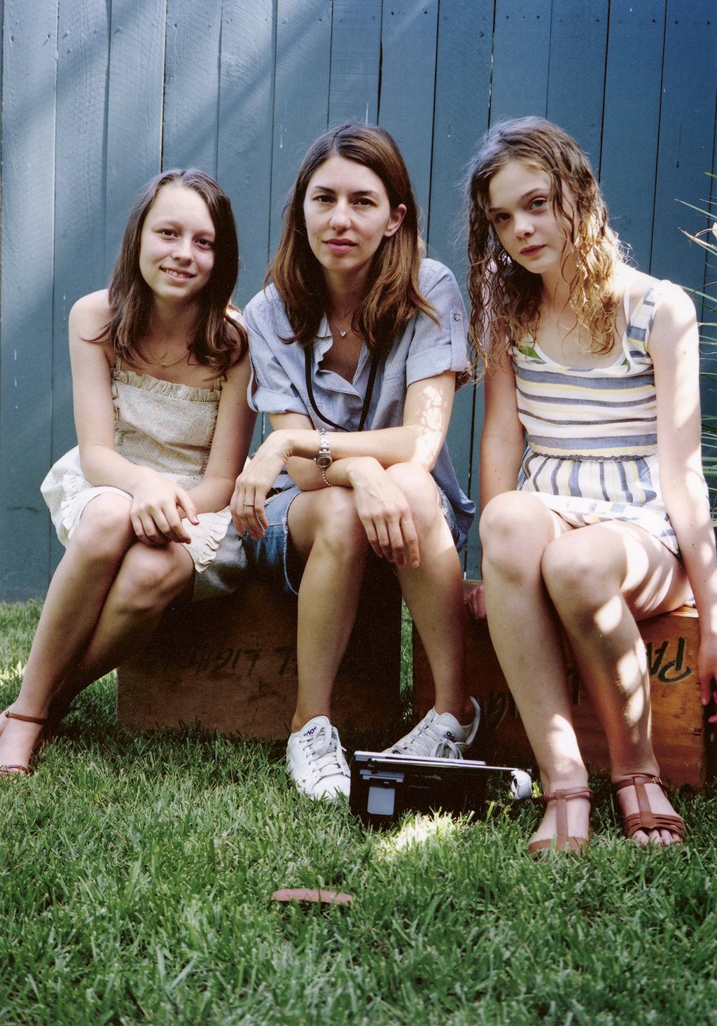 Coppola (middle) with Elle Fanning (right), one of her frequent collaborators.