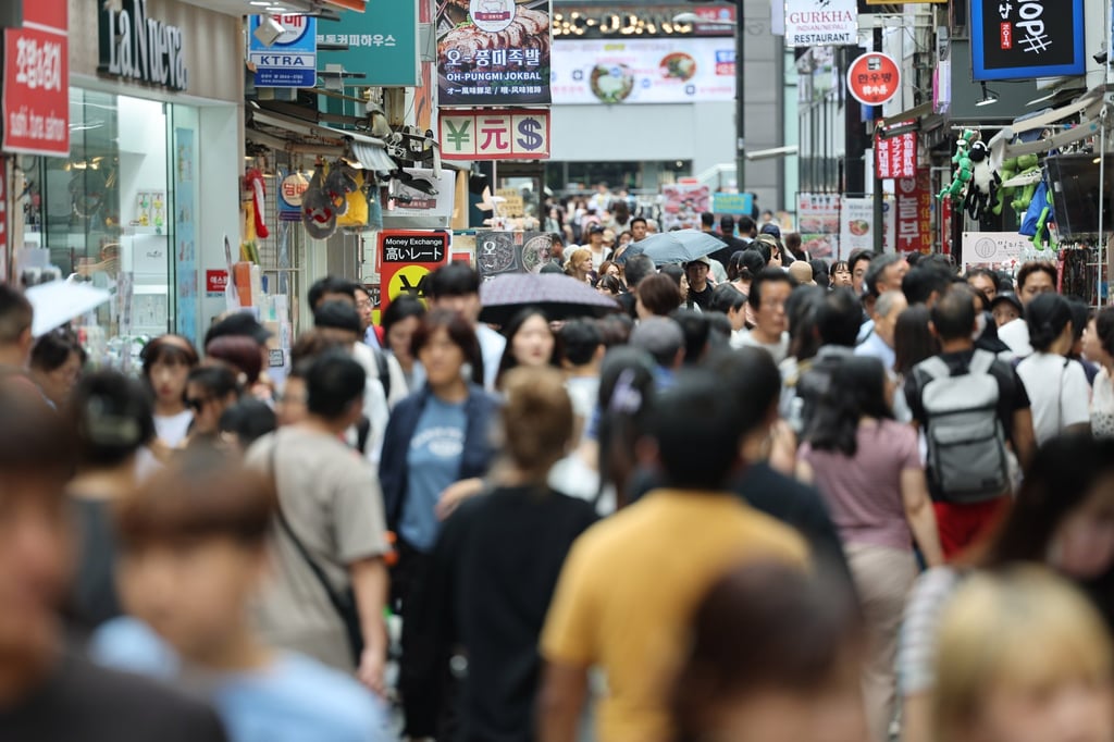 Foreign tourists crowd the popular shopping district of Myeongdong in central Seoul in late August, after China’s tourism authorities lifted its ban on group tours to South Korea. Photo: EPA-EFE/Yonhap