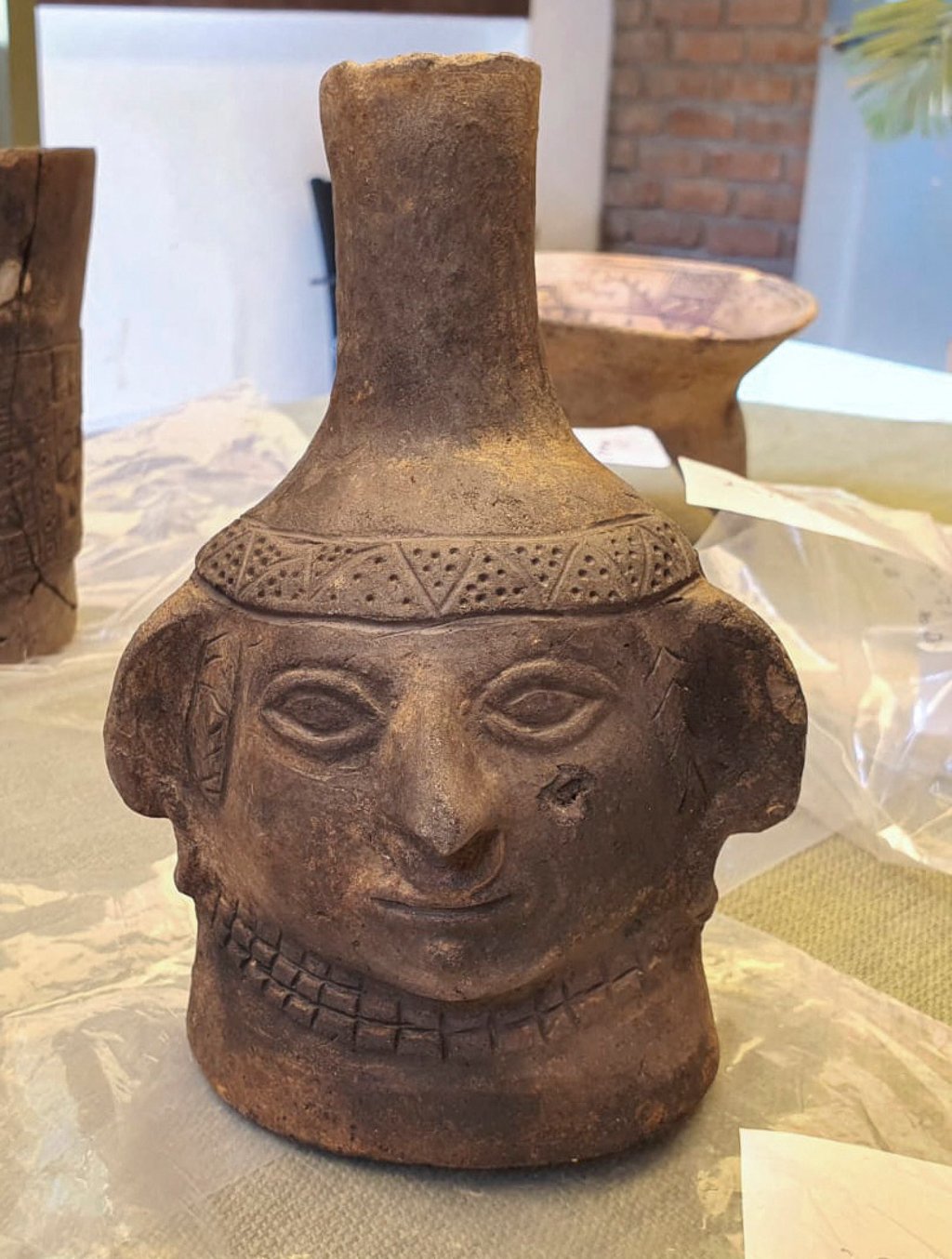 A ceramic vase with a human face discovered by Peruvian and Japanese archaeologists in a pre-Hispanic site from the Jequetepeque Valley in Cajamarca, Peru. Photo: Peruvian Ministry of Culture/AFP