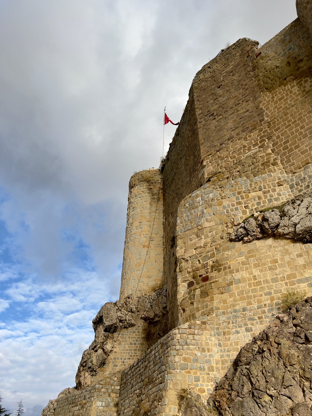 The walls of Harput Castle appear to sprout from the limestone outcrop on which it is built. Milk is said to have been used instead of water in its construction, leading to its alternative name, Milk Castle. Photo: Peter Neville-Hadley