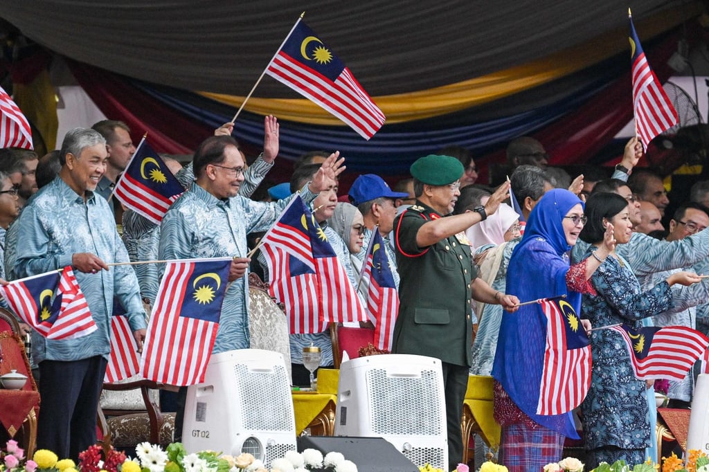 Ahmad Zahid (left) with PM Anwar (second from left), Malaysia’s King Sultan Abdullah Sultan Ahmad Shah (second from right) and Queen Tunku Azizah Aminah Maimunah Iskandariah (right) at the country’s 66th National Day celebrations in Putrajaya on August 31. Photo: AFP