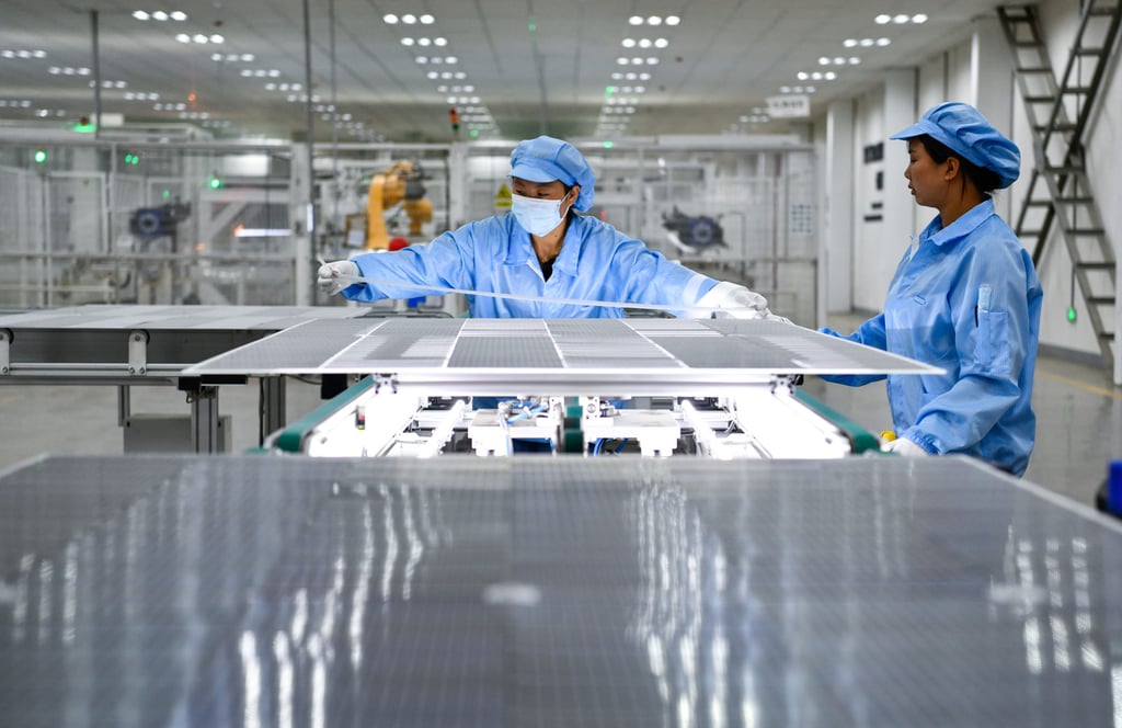 Workers produce photovoltaic modules at the workshop of a new energy company in Yi-Hui-Miao Autonomous County of Weining, in southwest China’s Guizhou Province, on July 19, 2023. Photo: Xinhua