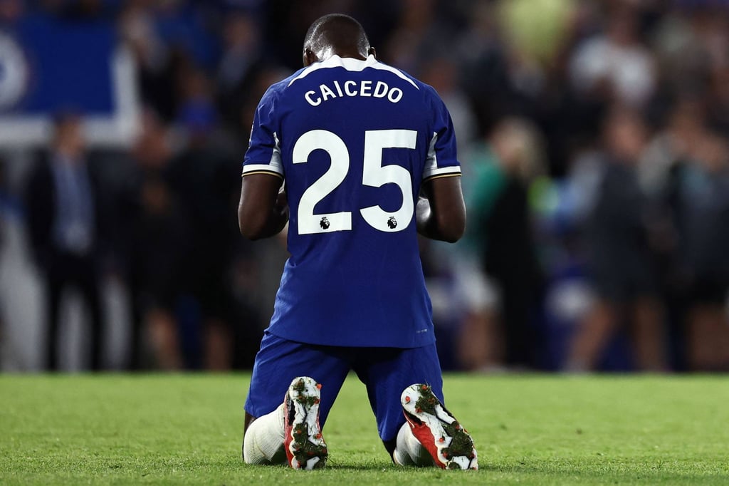 Chelsea’s Ecuadorian midfielder Moises Caicedo prays at the end a match. Photo: AFP