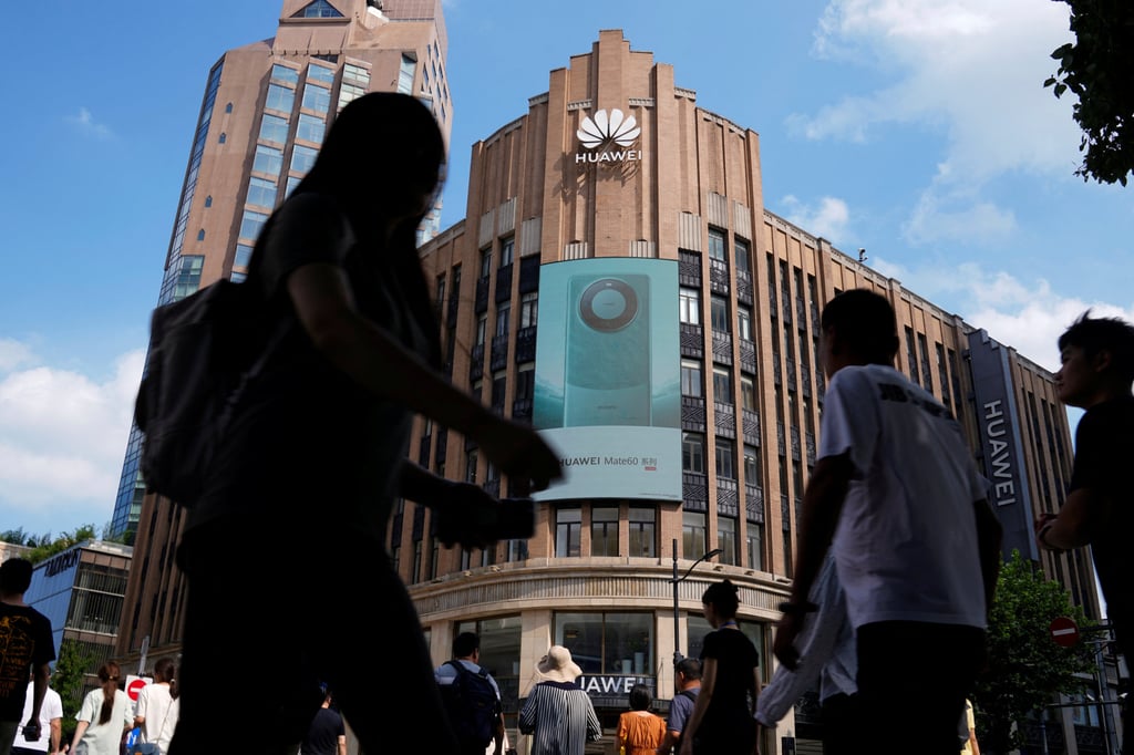 Pedestrians walk past an advertisement for Huawei Technologies’ new Mate 60-series 5G smartphones outside a Huawei store in Shanghai on September 8, 2023. Photo: Reuters Pedestrians walk past an advertisement for Huawei Technologies’ new Mate 60-series 5G smartphones outside a Huawei store in Shanghai on September 8, 2023. Photo: Reuters