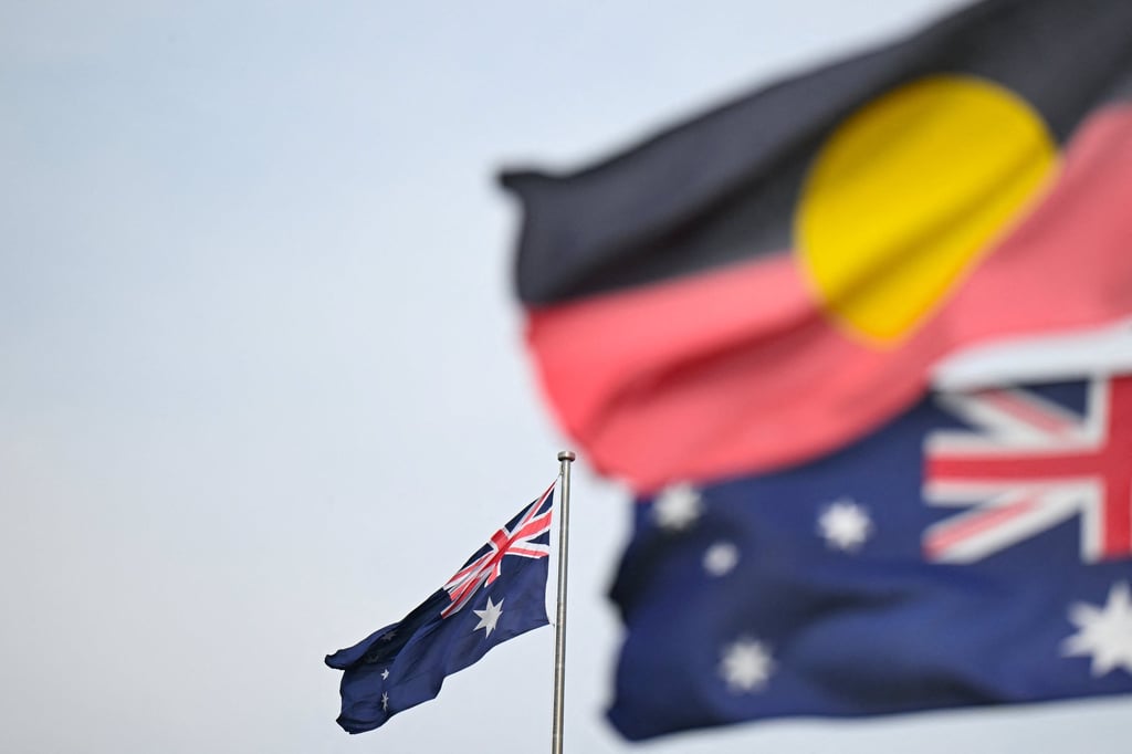 Australian and Aboriginal flags are seen in Canberra. Photo: AAP/Reuters Australian and Aboriginal flags are seen in Canberra. Photo: AAP/Reuters