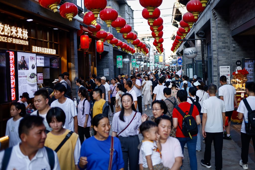 People walk around a shopping district in Beijing, China. Photo: EPA-EFE