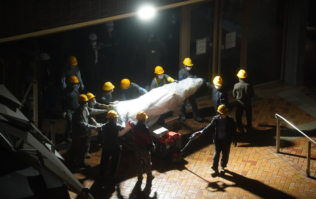 Workers remove the Pillar of Shame sculpture from the University of Hong Kong back in 2021. Photo: Sam Tsang Workers remove the Pillar of Shame sculpture from the University of Hong Kong back in 2021. Photo: Sam Tsang
