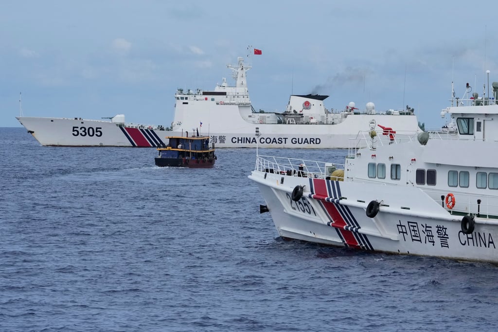 A Philippine supply boat manoeuvres around Chinese coastguard ships attempting to block access to Second Thomas Shoal, more than 1,000km south of mainland China and about 300km west of the Philippines’ Palawan province. Photo: AP