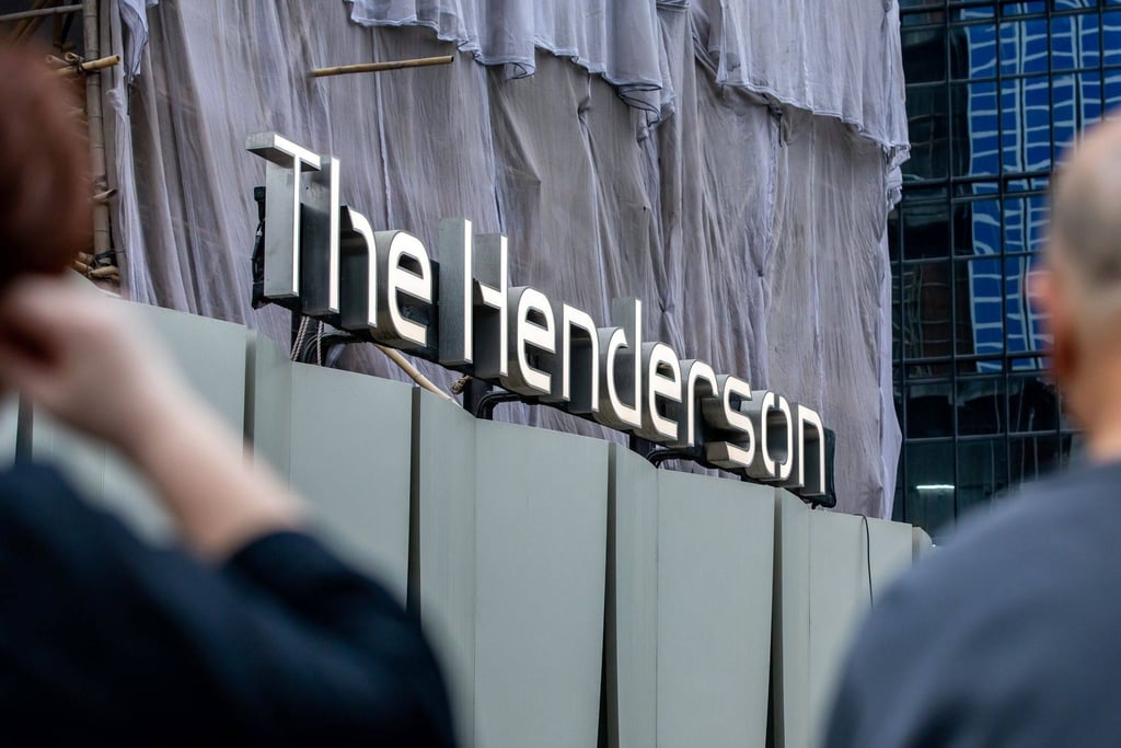 Signage at the construction site of the Henderson commercial building, developed by Henderson Land Development Co., in Hong Kong, China. Photo: Bloomberg