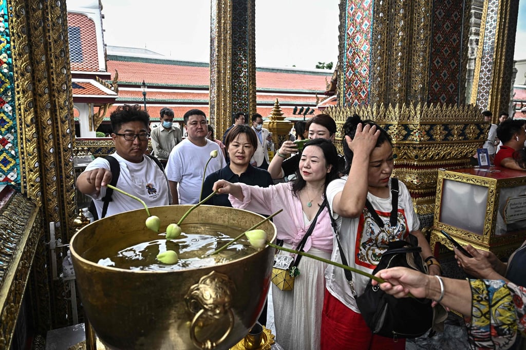 Chinese tourists at the Grand Palace in Bangkok. Chinese visitors accounted for nearly a third of Thailand’s almost 40 million tourist arrivals in 2019 before the pandemic. Photo: AFP