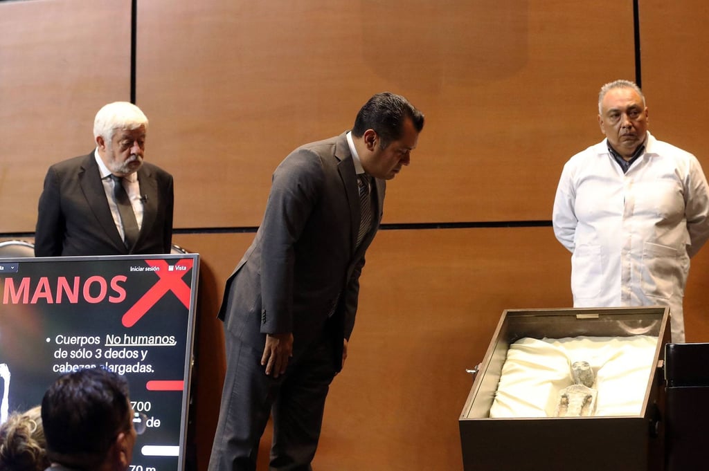 Mexican congressman Sergio Gutierrez looks at one of the tiny figures. Photo: Mexico’s Congress via AFP Mexican congressman Sergio Gutierrez looks at one of the tiny figures. Photo: Mexico’s Congress via AFP