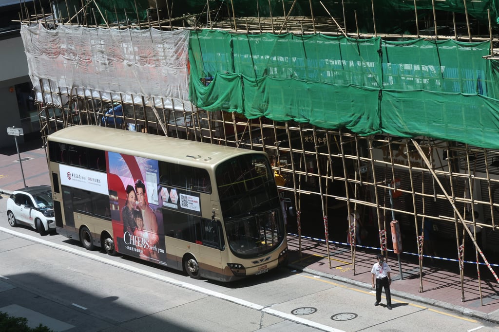 Illustrating the city’s problem with crumbling old buildings, a concrete chunk fell from the 57-year-old Sun Hing Building on Nathan Road in Mong Kok and hit the roof of a bus. Photo: Edmond So Illustrating the city’s problem with crumbling old buildings, a concrete chunk fell from the 57-year-old Sun Hing Building on Nathan Road in Mong Kok and hit the roof of a bus. Photo: Edmond So