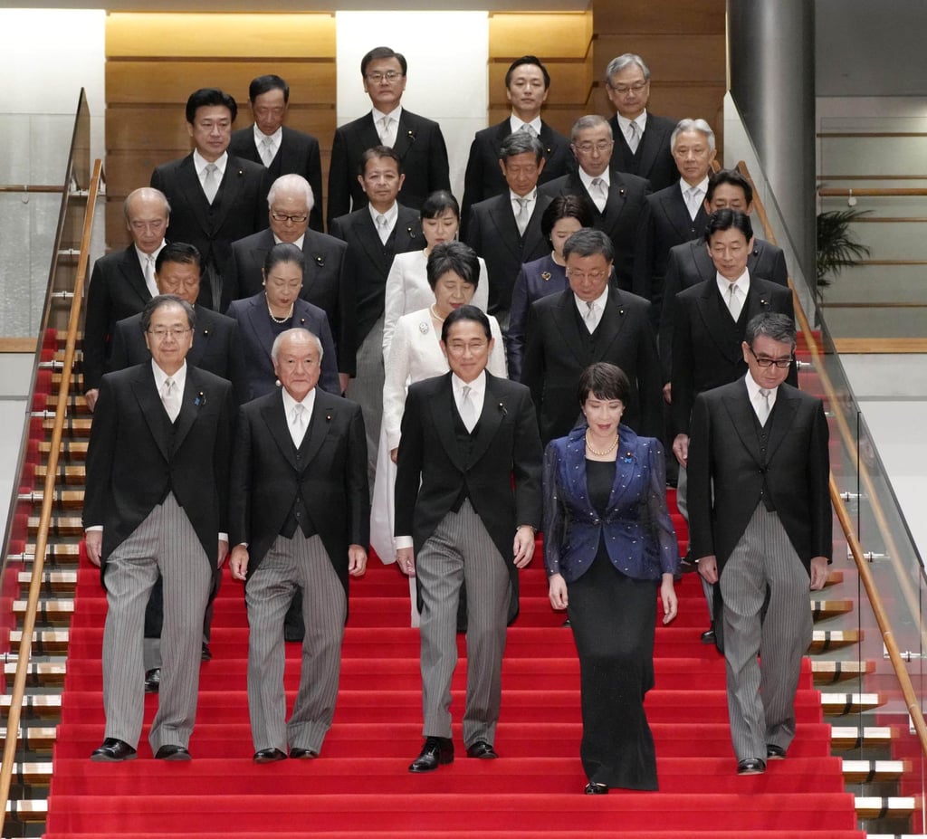 Japanese Prime Minister Fumio Kishida (first row, middle) and members of his reshuffled Cabinet at the prime minister’s office in Tokyo. Photo: Kyodo
