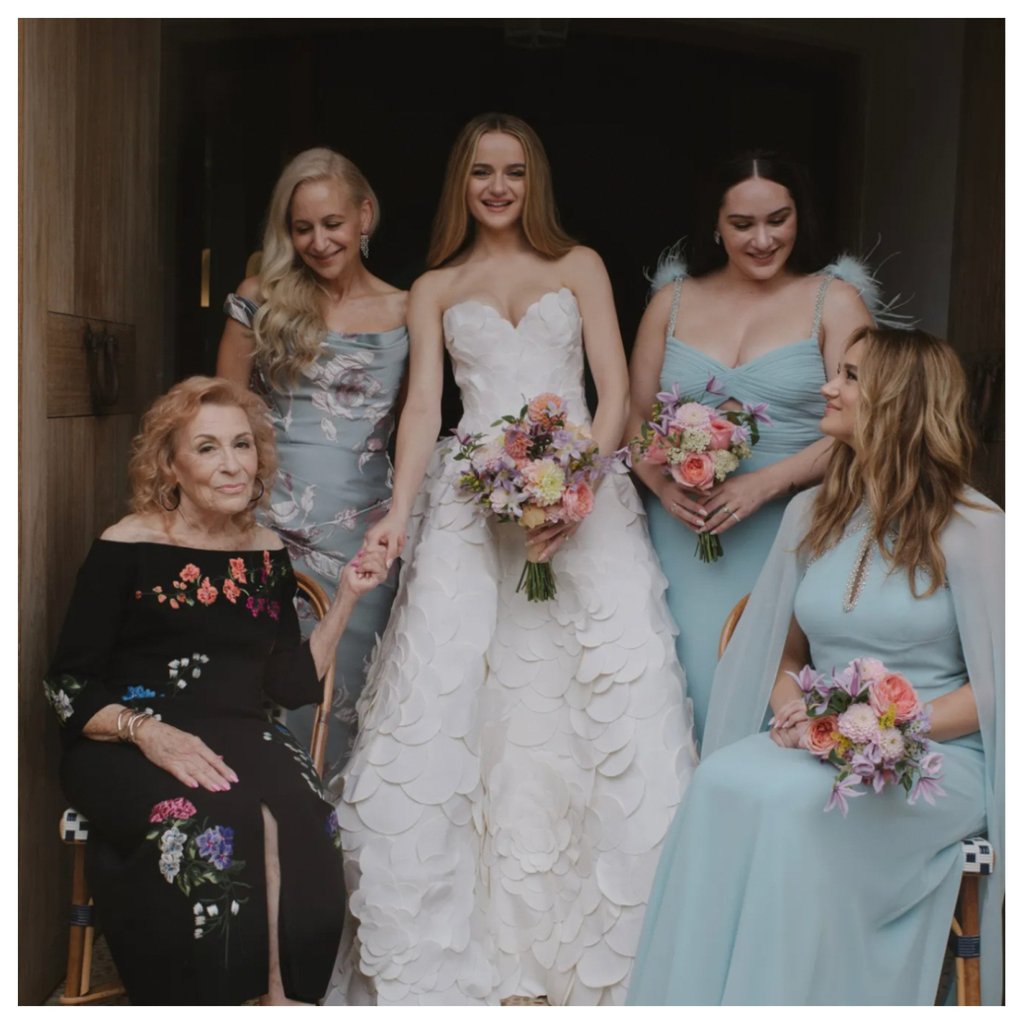 Joey King got married in a stunning Oscar de la Renta gown comprised of hundreds of circular, flower-petal paillettes. Photo: @alexandercollectionofficial/Instagram