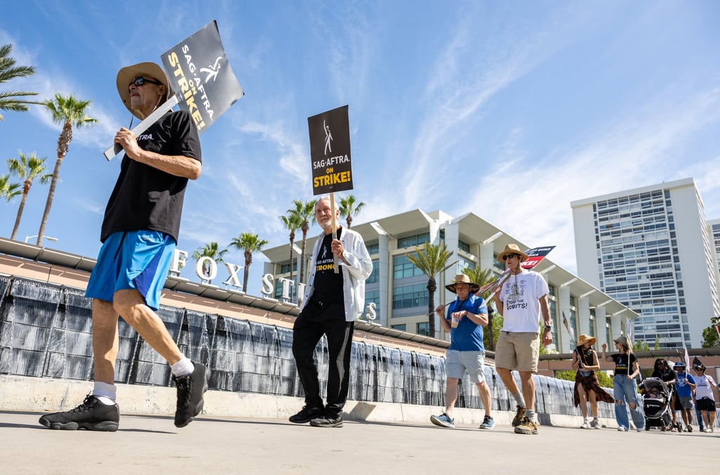 Members and supporters of Sag-Aftra and WGA walk the picket line at Fox Studios in Los Angeles, California, on July 21. Photo: AFP Members and supporters of Sag-Aftra and WGA walk the picket line at Fox Studios in Los Angeles, California, on July 21. Photo: AFP