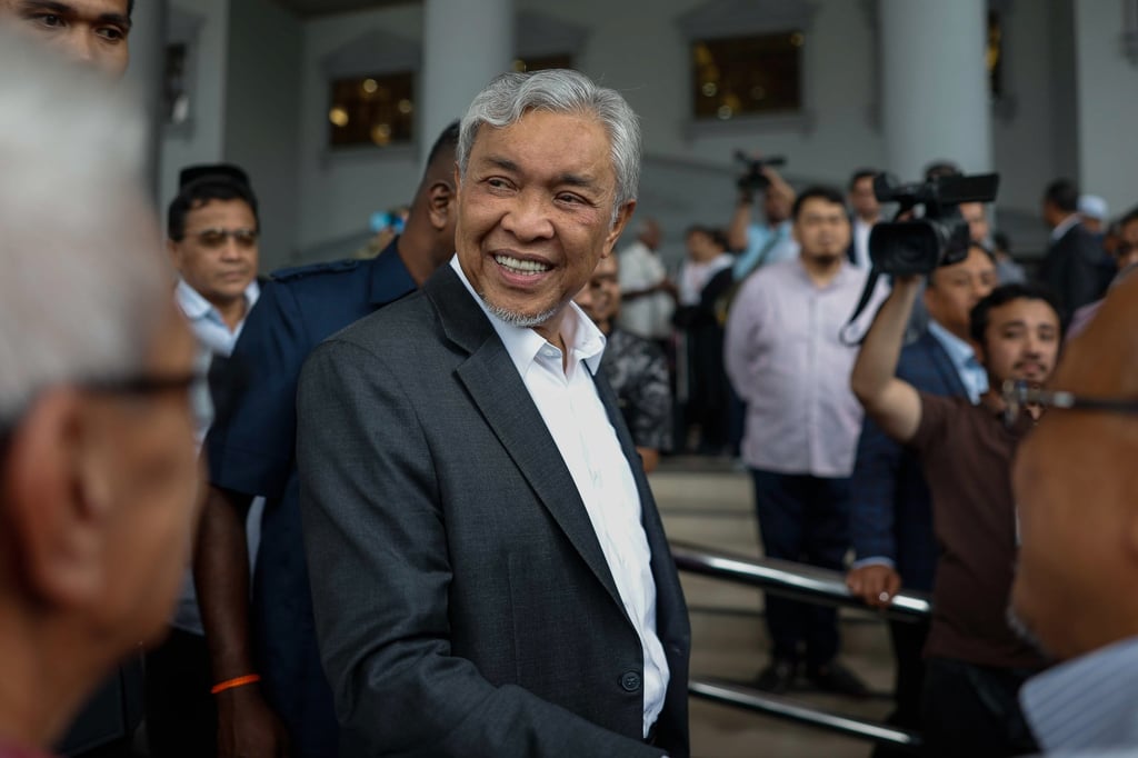 Malaysian Deputy Prime Minister Ahmad Zahid leaves the High Court after the court dismissed 47 corruption charges against him on September 4. Photo: Bernama/dpa