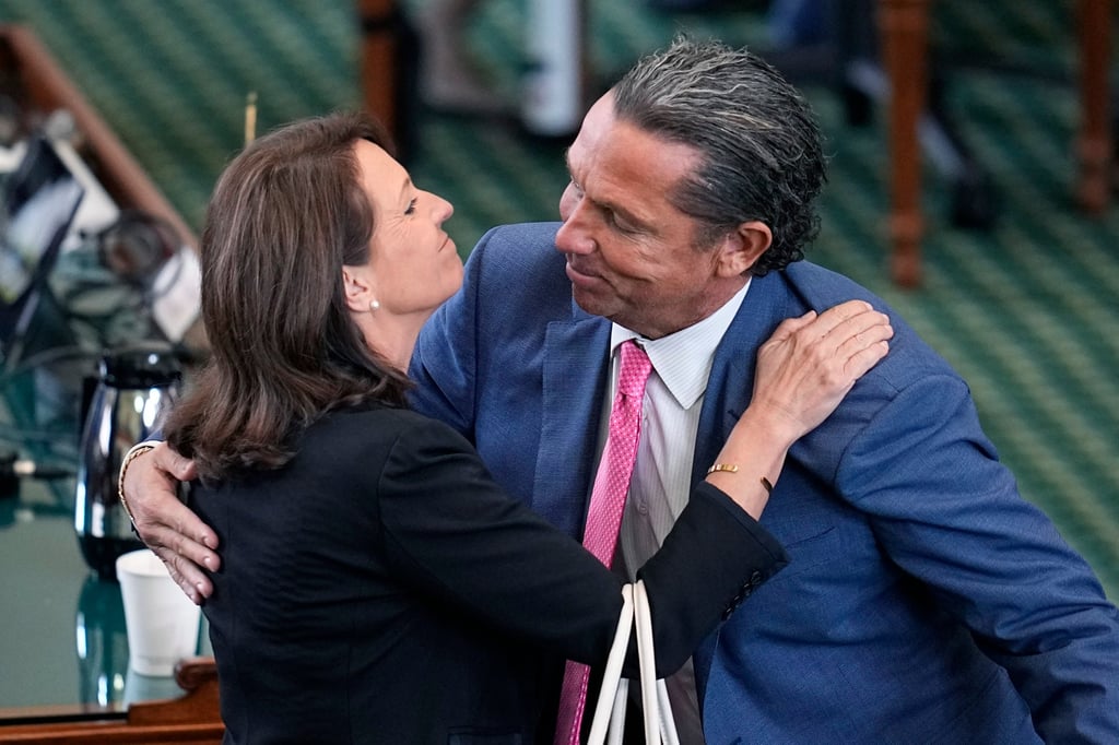 Texas state Senator Angela Paxton embraces lawyer Tony Buzbee as they celebrate the acquittal of her husband, Texas Attorney General Ken Paxton, in his impeachment trial in Austin on Saturday. Photo: AP