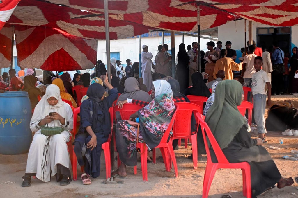 Sudanese wait outside a Passports and Immigration Services office in Port Sudan, desperate to obtain paperwork that will allow them to leave Sudan’s deadly war behind. Photo: AFP Sudanese wait outside a Passports and Immigration Services office in Port Sudan, desperate to obtain paperwork that will allow them to leave Sudan’s deadly war behind. Photo: AFP