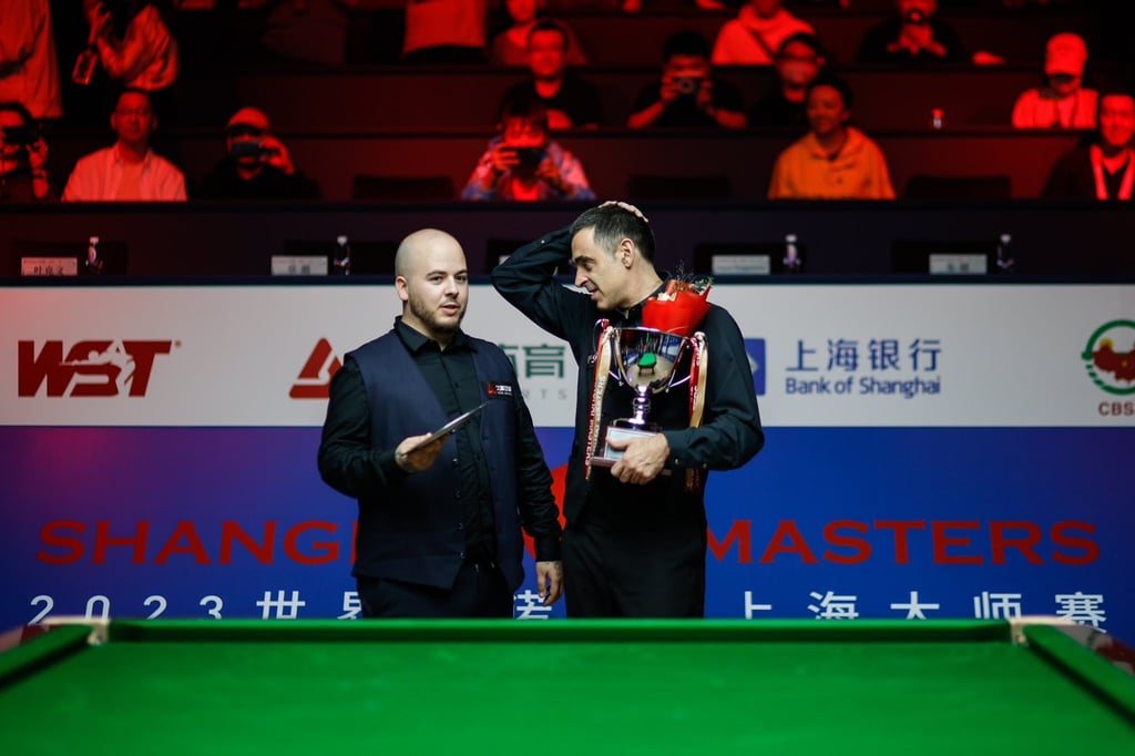 Luca Brecel (left) and Ronnie O’Sullivan chat after Sunday’s final in Shanghai. Photo: Twitter/@ronnieo147