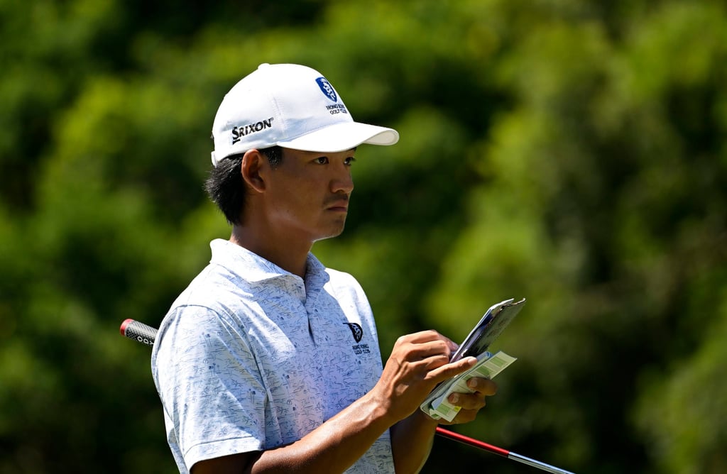 Taichi Kho checks his yardage book during the first round at Linkou International Golf and Country Club. Photo: Asian Tour. Taichi Kho checks his yardage book during the first round at Linkou International Golf and Country Club. Photo: Asian Tour.