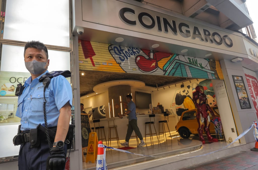 Police officers raided Coingaroo, a cryptocurrency exchange in Hong Kong with ties to JPEX. Photo: Jelly Tse Police officers raided Coingaroo, a cryptocurrency exchange in Hong Kong with ties to JPEX. Photo: Jelly Tse