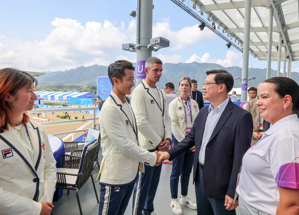 Chief Executive John Lee meets athletes and horse racing experts at the Tonglu Equestrian Centre. Photo: John Lee Facebook