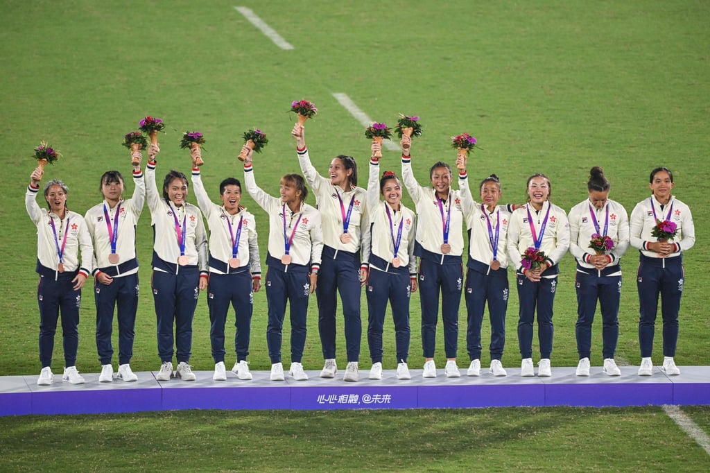 Hong Kong’s women salute the crowd after winning bronze in the rugby sevens. Photo: AFP Hong Kong’s women salute the crowd after winning bronze in the rugby sevens. Photo: AFP