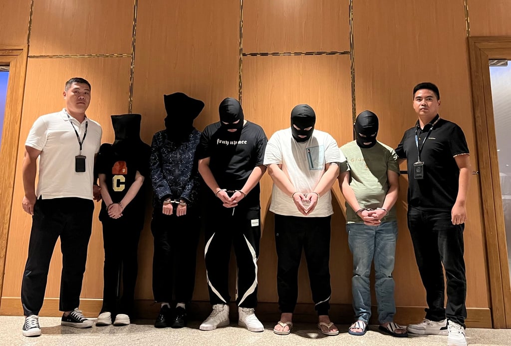 Myanmar police hand over fraud suspects to Chinese police at Yangon International Airport last month. Photo: Chinese Embassy in Myanmar/Handout via Xinhua