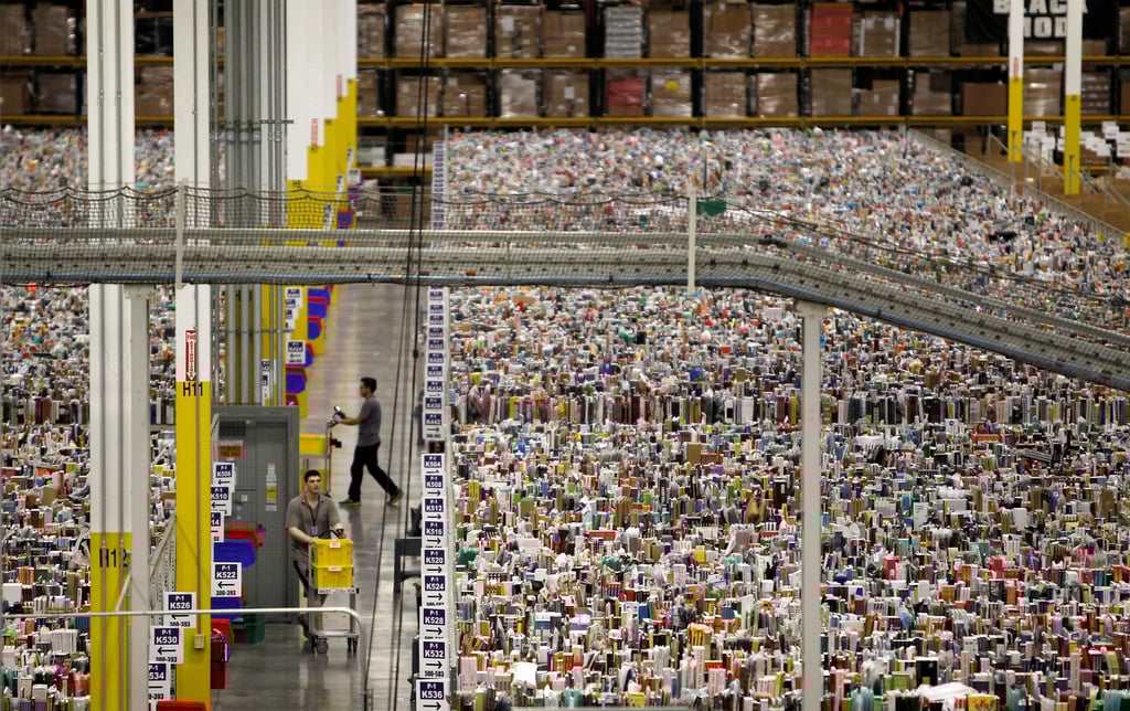 Workers gathered items for delivery from the warehouse floor at Amazon’s distribution centre in Phoenix, Arizona back in 2013. Photo: Reuters