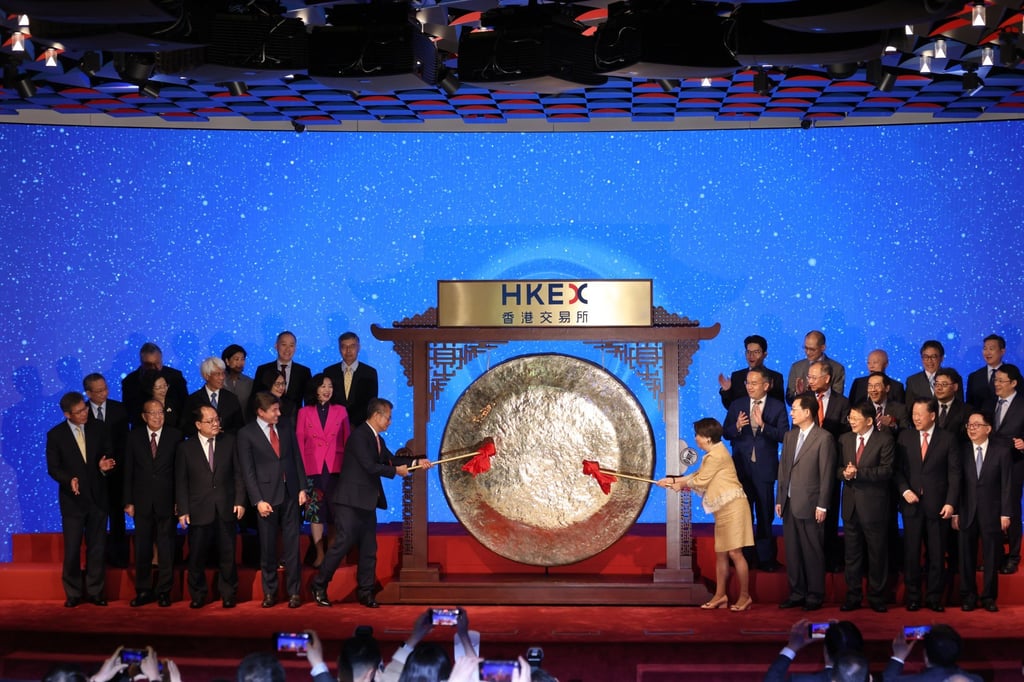 Financial Secretary Paul Chan Mo-po (centre left), HKEX Chairman Laura Cha Shih May-lung (centre right) and officials attend the gong striking ceremony to celebrate the 30th anniversary of H-shares at Hong Kong Exchanges and Clearing on August 22, 2023. Photo: Yik Yeung-man