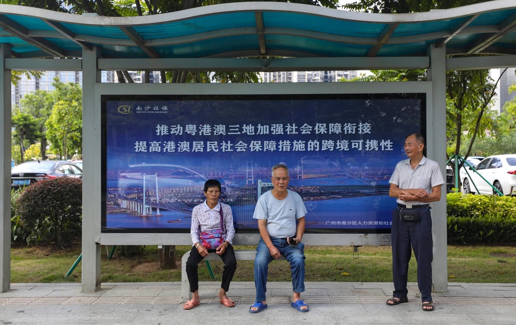 People wait in a bus shelter in Guangzhou, one of the mainland China cities in the Greater Bay Area. Photo: Xiaomei Chen